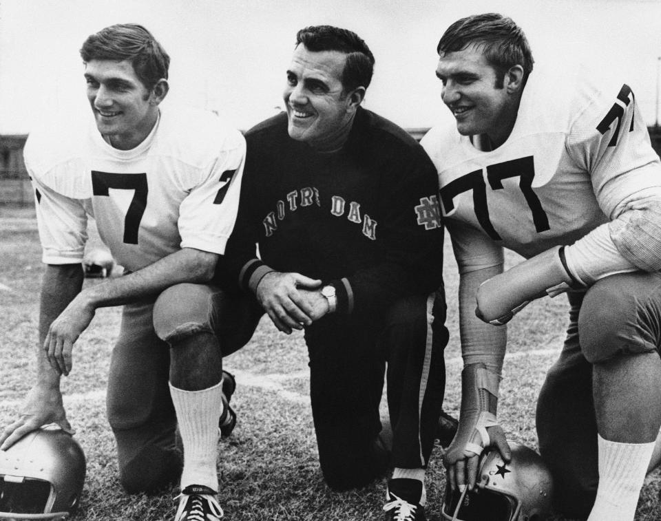 Notre Dame head football coach Ara Parseghian, center, poses with quarterback Joe Theismann (7), left, and All-America defense tackle Mike McCoy, in Dallas, Texas, Dec. 29, 1969.nAP file photo