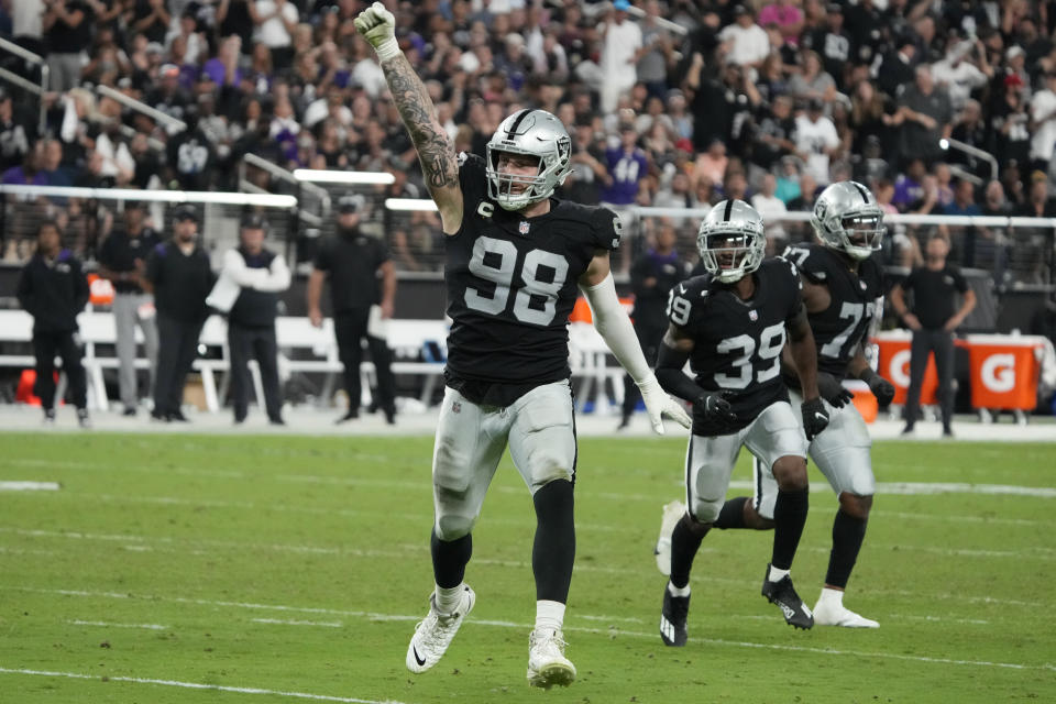 Las Vegas Raiders defensive end Maxx Crosby (98) celebrates after tackling Baltimore Ravens quarterback Lamar Jackson (8) during the second half of an NFL football game, Monday, Sept. 13, 2021, in Las Vegas. (AP Photo/Rick Scuteri)