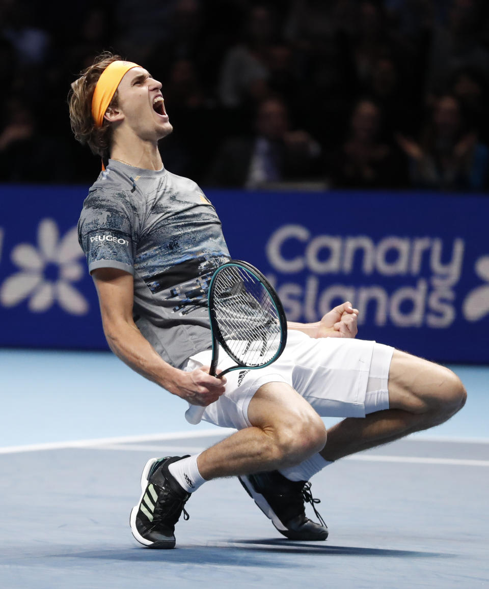 Germany's Alexander Zverev celebrates after defeating Russia's Daniil Medvedev in their ATP World Tours Finals singles tennis match at the O2 Arena in London, Friday, Nov. 15, 2019. (AP Photo/Alastair Grant)