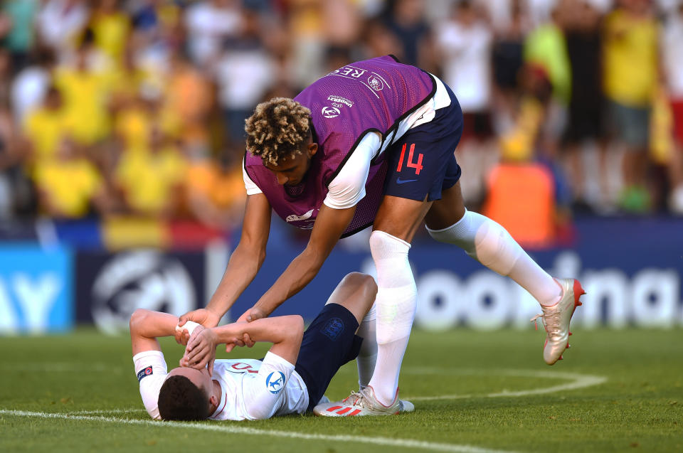 Phil Foden of England is comforted by Lloyd Kelly on a disappointing night for England. (Photo by Denis Doyle - UEFA/UEFA via Getty Images)