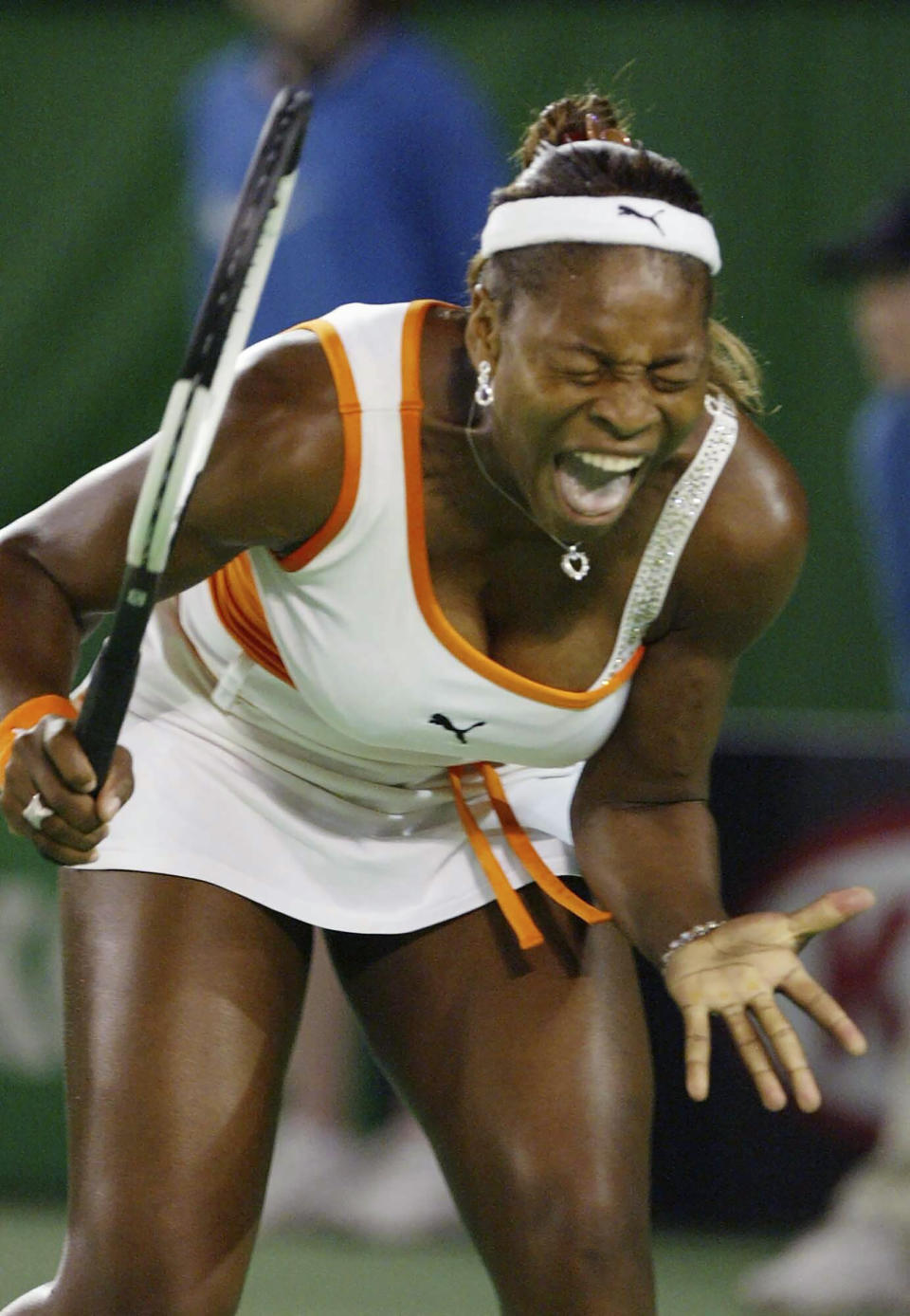 FILE - Serena Williams of the United States screams in her match against her sister, Venus, in the women's singles final at the Australian Open Tennis Tournament in Melbourne, Saturday, Jan. 25, 2003. Saying “the countdown has begun,” 23-time Grand Slam champion Serena Williams announced Tuesday, Aug. 9, 2022, she is ready to step away from tennis so she can turn her focus to having another child and her business interests, presaging the end of a career that transcended sports. (AP Photo/Rick Stevens, File)