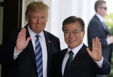 FILE PHOTO: U.S. President Donald Trump  (L) welcomes South Korean President Moon Jae-in at the White House in Washington, DC, U.S., June 30, 2017. REUTERS/Jim Bourg/File Photo