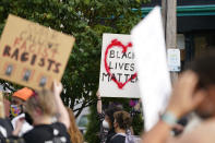 Black Lives Matter protesters march, Friday, Sept. 25, 2020, in Louisville. Breonna Taylor's family demanded Friday that Kentucky authorities release all body camera footage, police files and the transcripts of the grand jury hearings that led to no charges against police officers who killed the Black woman during a March drug raid at her apartment. (AP Photo/Darron Cummings)