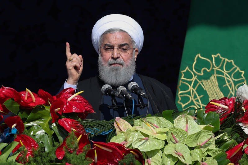 Iranian President Hassan Rouhani gestures as he speaks during a rally marking the anniversary of Iran's 1979 Islamic revolution, in Tehran, Iran, February 11, 2018. President.ir/Handout via REUTERS