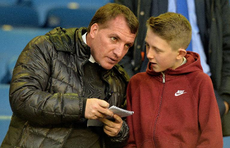 Liverpool's manager Brendan Rodgers signs autographs before an English Premier League match at Goodison Park in Liverpool, on April 16, 2014