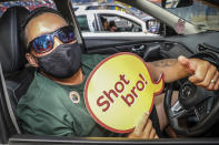 Jason Waitoa waits for his vaccination in Rotorua, New Zealand, Saturday, Oct. 16, 2021. New Zealand health care workers have administered a record number of vaccine jabs as the nation holds a festival aimed at getting more people inoculated against the coronavirus. (Andrew Warner/NZME via AP)