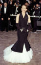 Kristin Scott Thomas, in a tuxedo inspired gown, attends the Cannes Film Festival on May 21, 1999.