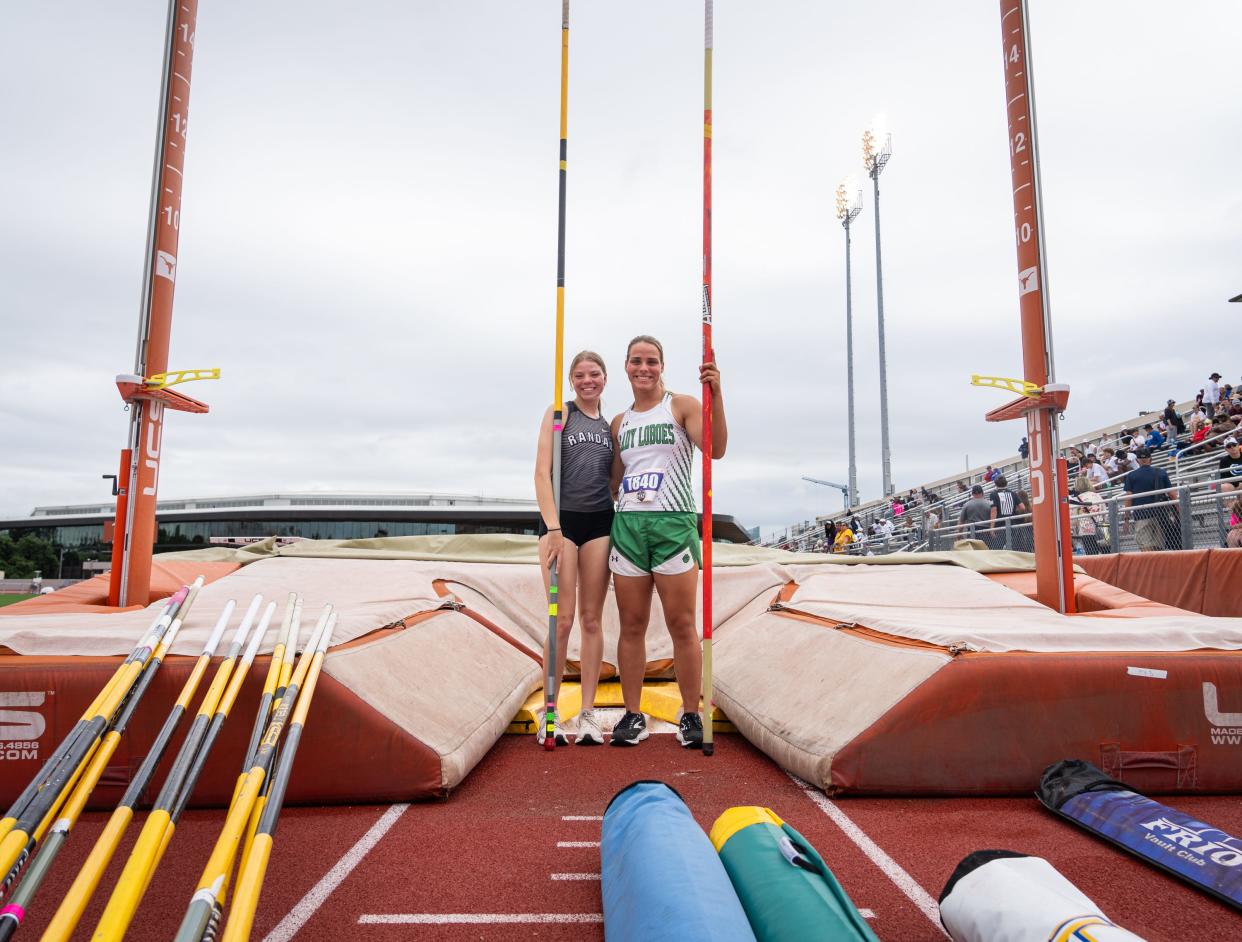 Canyon Randall's Sophia Bush, left, and Monahans' Valerie Hunt stand together after competing in the Class 4A pole vault Thursday at the UIL state track and field meet at Myers Stadium. Bush, who was born in Ukraine, and Hunt, who was born in Russia, both were adopted by American families 16 years ago.