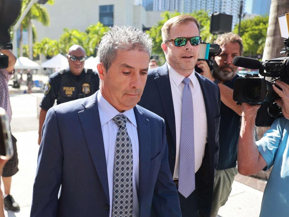 PHOTO: Carlos De Oliveira (L), a property manager for former President Donald Trump's Mar-a-Lago estate, arrives with his lawyer John Irving at the James Lawrence King Federal Justice Building on July 31, 2023 in Miami, Fla. (Joe Raedle/Getty Images, FILE)