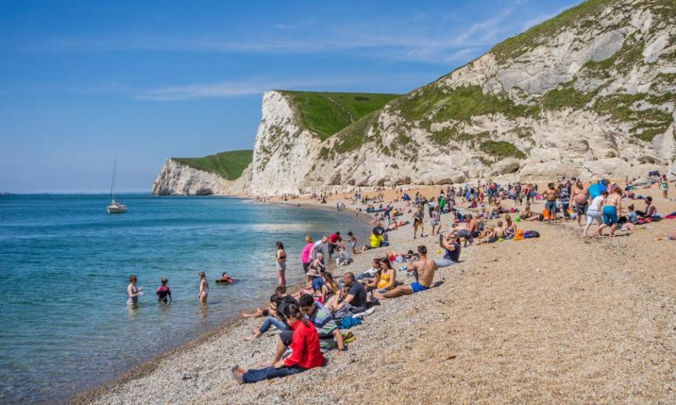 Summer on Durdle Door beach in Dorset. Many British holidaymakers who booked a domestic break this summer will not have considered insurance for a UK trip.