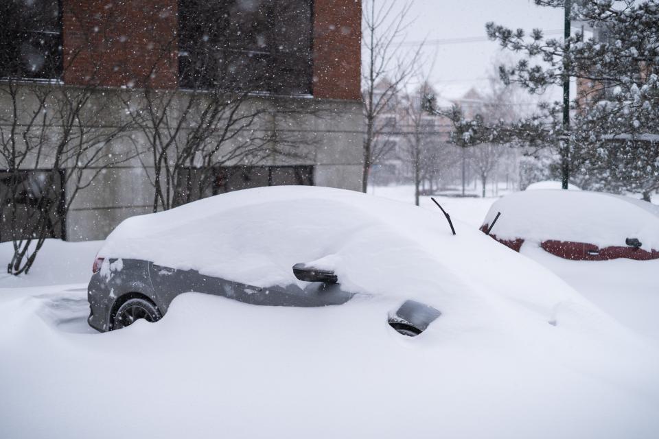 A car has been nearly entirely covered in snow on Sunday afternoon, Jan. 20, 2019, in South Burlington.