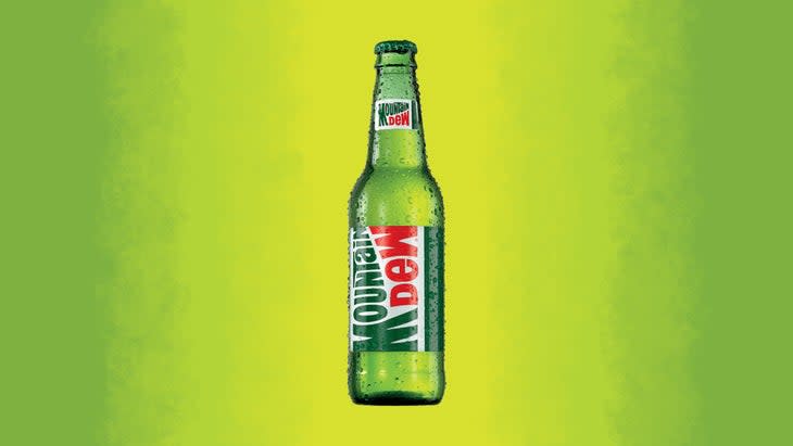 Mountain Dew original bottle on green background