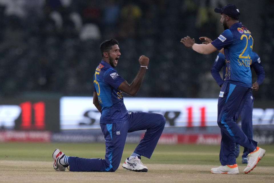 Sri Lanka's Kasun Rajitha, left, and teammates celebrate after the dismissal of Afghanistan's Rahmanullah Gurbaz during the Asia Cup cricket match between Afghanistan and Sri Lanka in Lahore, Pakistan, Tuesday, Sept. 5, 2023. (AP Photo/K.M. Chaudary)