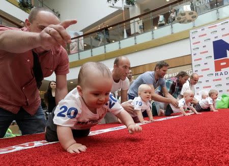 Babies crawl during the Baby Race to mark international Children's Day in Vilnius, Lithuania, June 1, 2016. REUTERS/Ints Kalnins