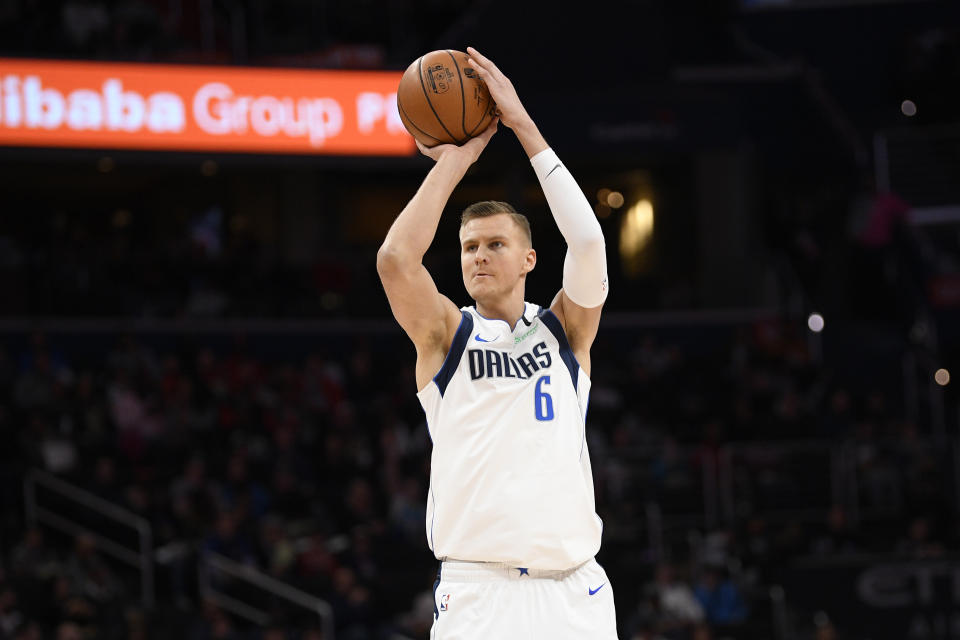 Dallas Mavericks forward Kristaps Porzingis (6) shoots during the first half of an NBA basketball game against the Washington Wizards, Friday, Feb. 7, 2020, in Washington. (AP Photo/Nick Wass)