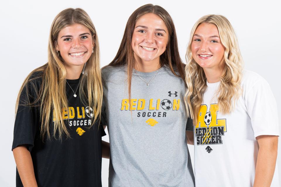 (From left) Red Lion soccer players Izzy Walker, Ellie Rymer and Hannah Kramer pose for a photo during YAIAA fall sports media day on Thursday, August 3, 2023, in York.