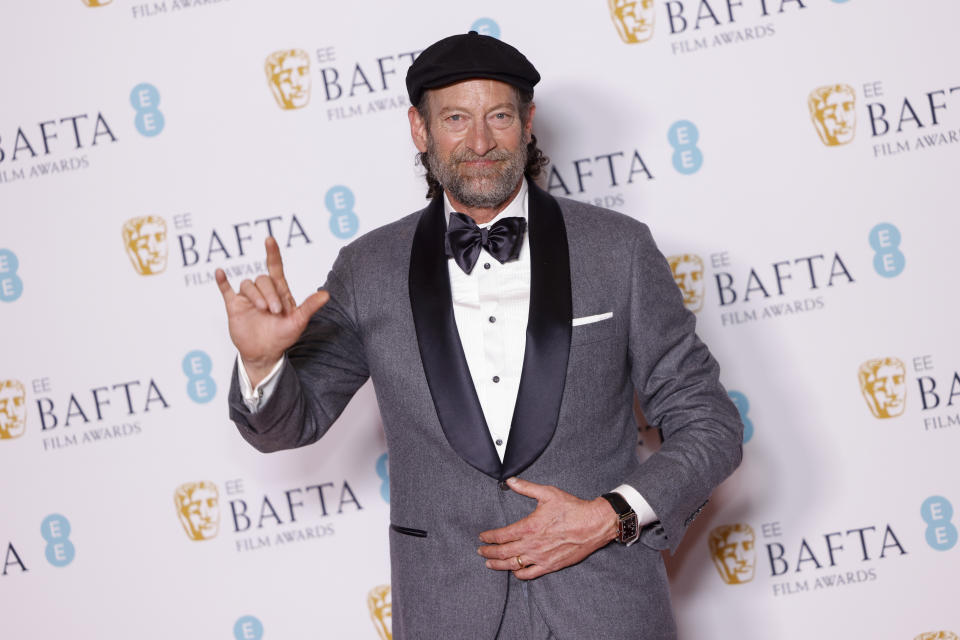 Troy Kotsur poses for photographers at the 76th British Academy Film Awards, BAFTA's, in London, Sunday, Feb. 19, 2023 (Photo by Vianney Le Caer/Invision/AP)