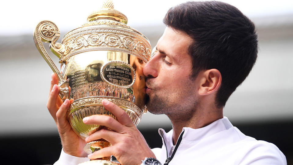 Seen here, Novak Djokovic kisses the Wimbledon trophy.