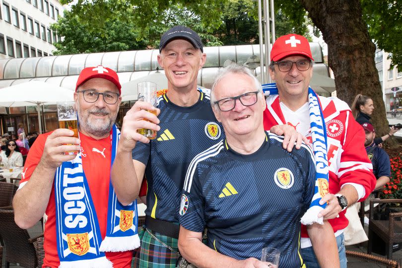 Scott Allison who travelled from Adelaide in Australia with dad John from Kilmarnock. Swiss fans are Markus Allemann and Franz Maag from Zurich