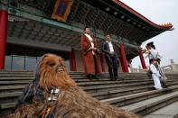 Fans dressed as the characters from "Star Wars" react during Star Wars Day in Taipei, Taiwan, May 4, 2016. REUTERS/Tyrone Siu