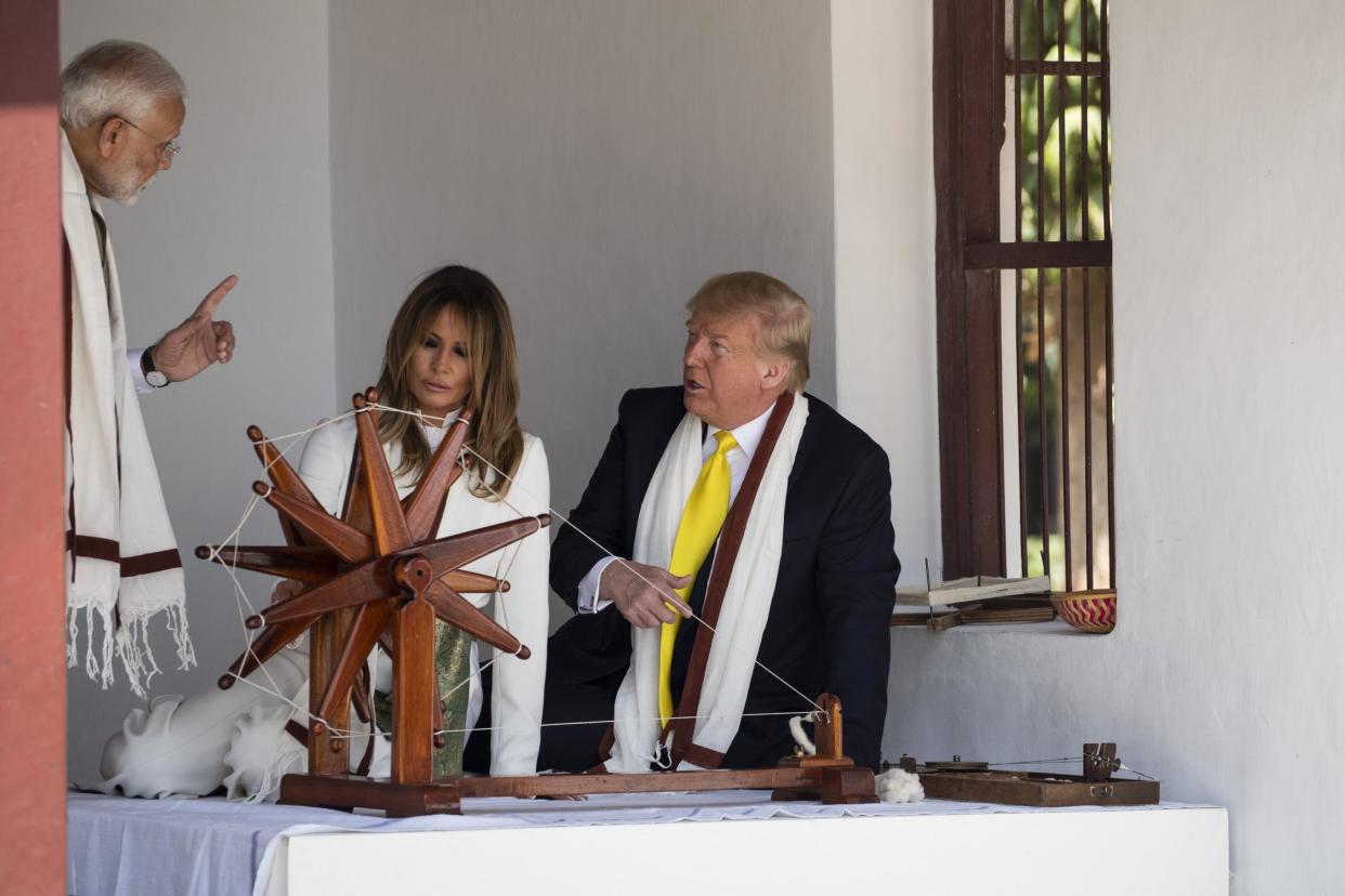 President Donald Trump, with first lady Melania Trump, and Indian Prime Minister Narendra Modi, look at a Charkha, or a spinning wheel, during a tour of Gandhi Ashram in Ahmedabad, India: (AP Photo/Alex Brandon)