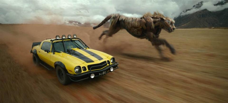 Bumblebee, left, and Cheetor head into battle in “Transformers: Rise of the Beasts.”