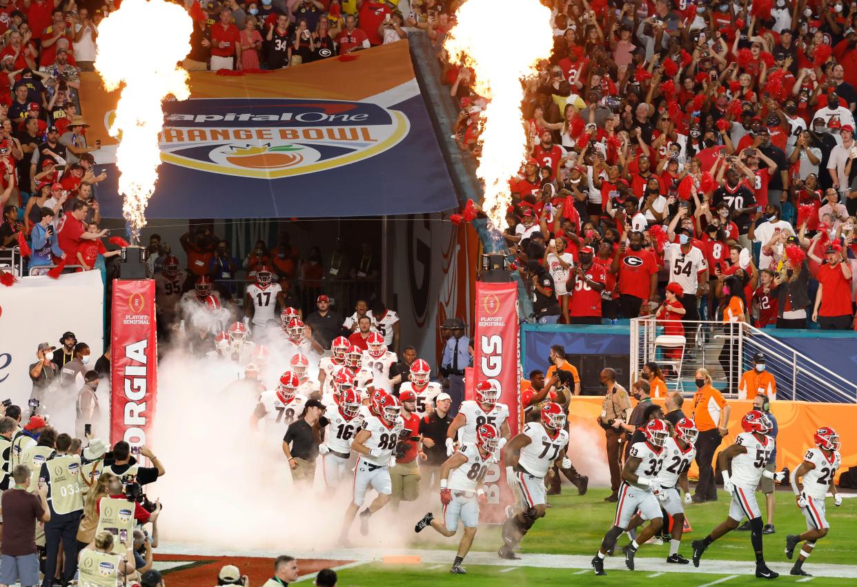 Dec 31, 2021; Miami Gardens, Florida, USA; The Georgia Bulldogs fans cheer as the Bulldogs enter the field before the College Football Playoff semifinal game against the Michigan Wolverines at Hard Rock Stadium. Mandatory Credit: Rhona Wise-USA TODAY Sports