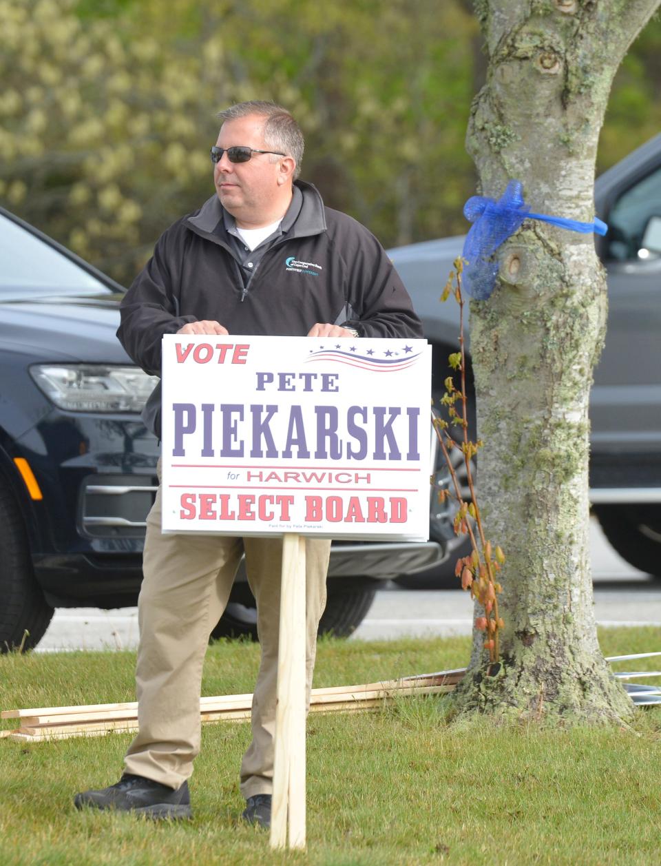 Peter Piekarski stands out in front of the Harwich Community Center shortly after the polls opened Tuesday morning. Piekarski ran unopposed for a seat on the Select Board.