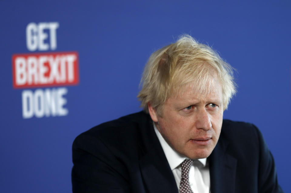 Britain's Prime Minister Boris Johnson listens to a question during a media conference in London, Friday, Nov. 29, 2019. Britain goes to the polls on Dec. 12. (AP Photo/Frank Augstein)