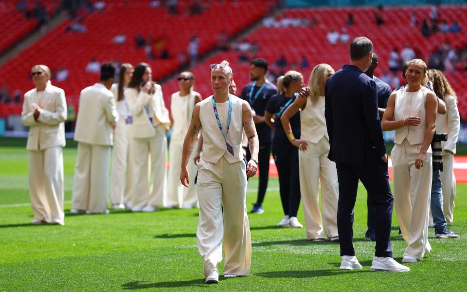 Spurs' star striker Beth England walks on the Wembley turf.