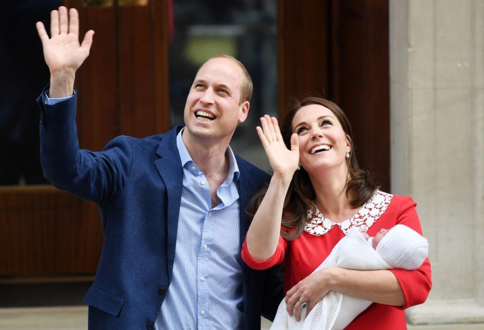 The Duke and Duchess of Cambridge greet a cheering crowd after welcoming their third child