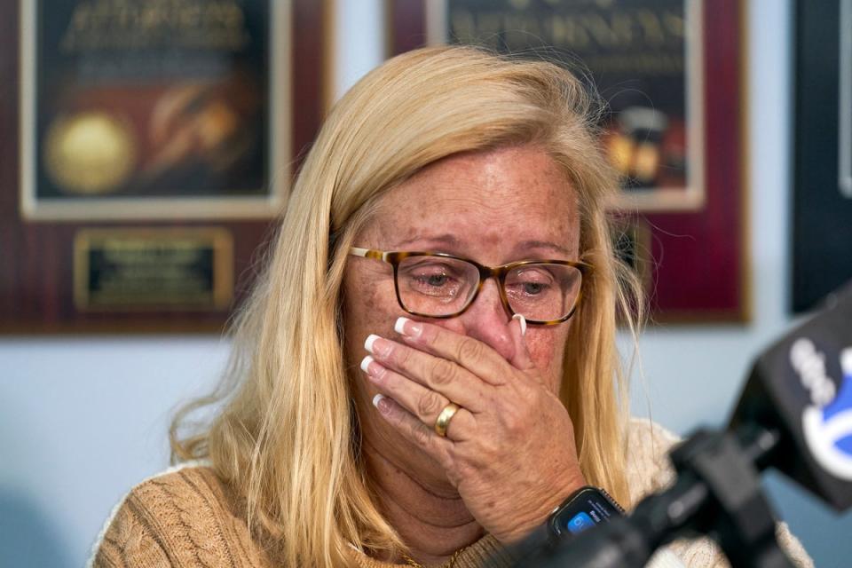 Kim Clinkunbroomer, the mother of late Los Angeles Sheriff's Deputy Ryan Clinkunbroomer, wipes tears as she takes questions from the media after announcing a precursor of a lawsuit against the Sheriff's Department at a news conference in Los Angeles on Tuesday, Nov. 28, 2023. (Copyright 2023 The Associated Press. All rights reserved)