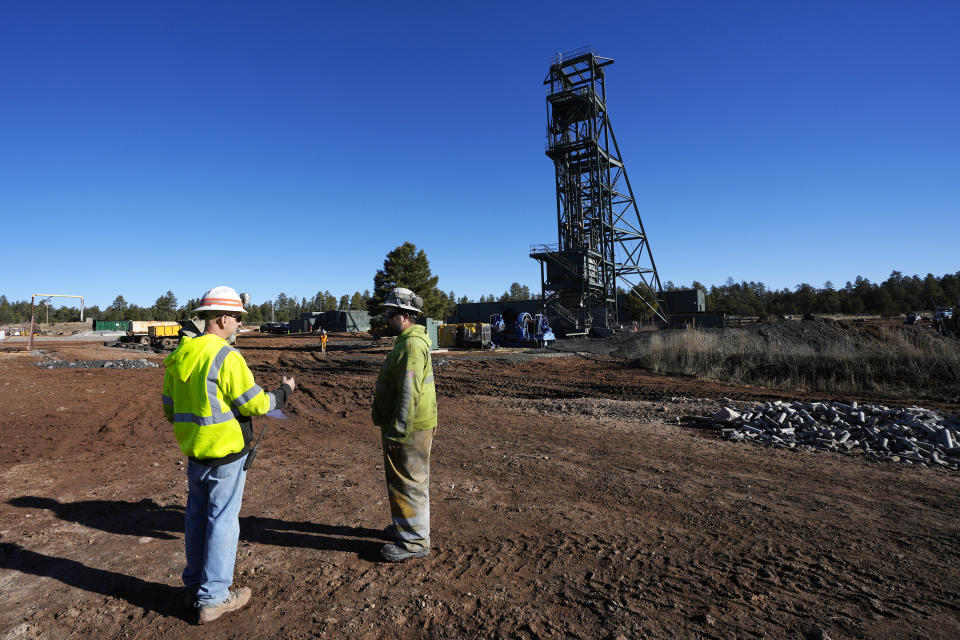 Workers talk at the Energy Fuels Inc. uranium Pinyon Plain Mine Wednesday, Jan. 31, 2024, near Tusayan, Ariz. The largest uranium producer in the United States is ramping up work just south of Grand Canyon National Park on a long-contested project that largely has sat dormant since the 1980s. (AP Photo/Ross D. Franklin)