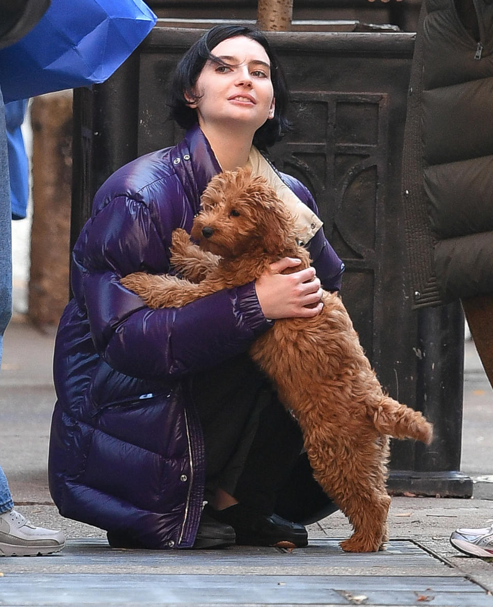 <p>Meadow Walker showers her puppy with love while on a walk through N.Y.C. on Nov. 18.</p>