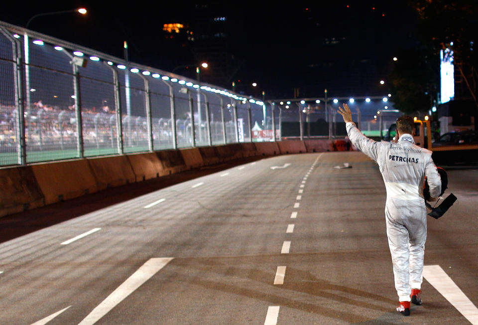 SINGAPORE , SINGAPORE - SEPTEMBER 23: Michael Schumacher of Germany and Mercedes GP is pictured after his crash during the Formula One Grand Prix of Singapore at Marina Bay Street Circuit on September 23, 2012 in Singapore, Singapore. (Photo by Vladimir Rys Photography/Getty Images)