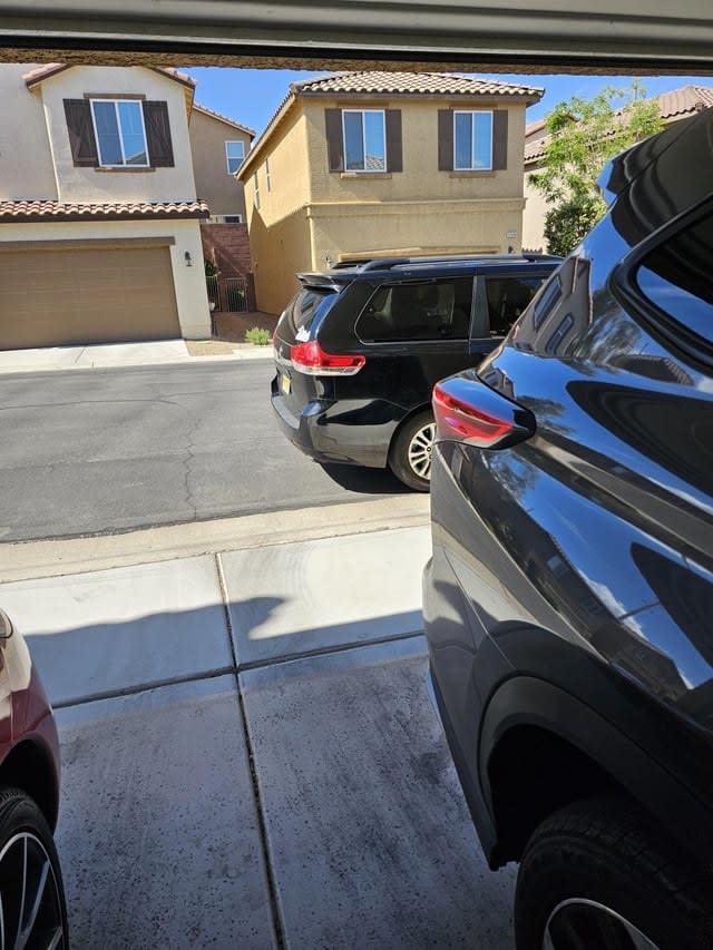 A car blocking a driveway