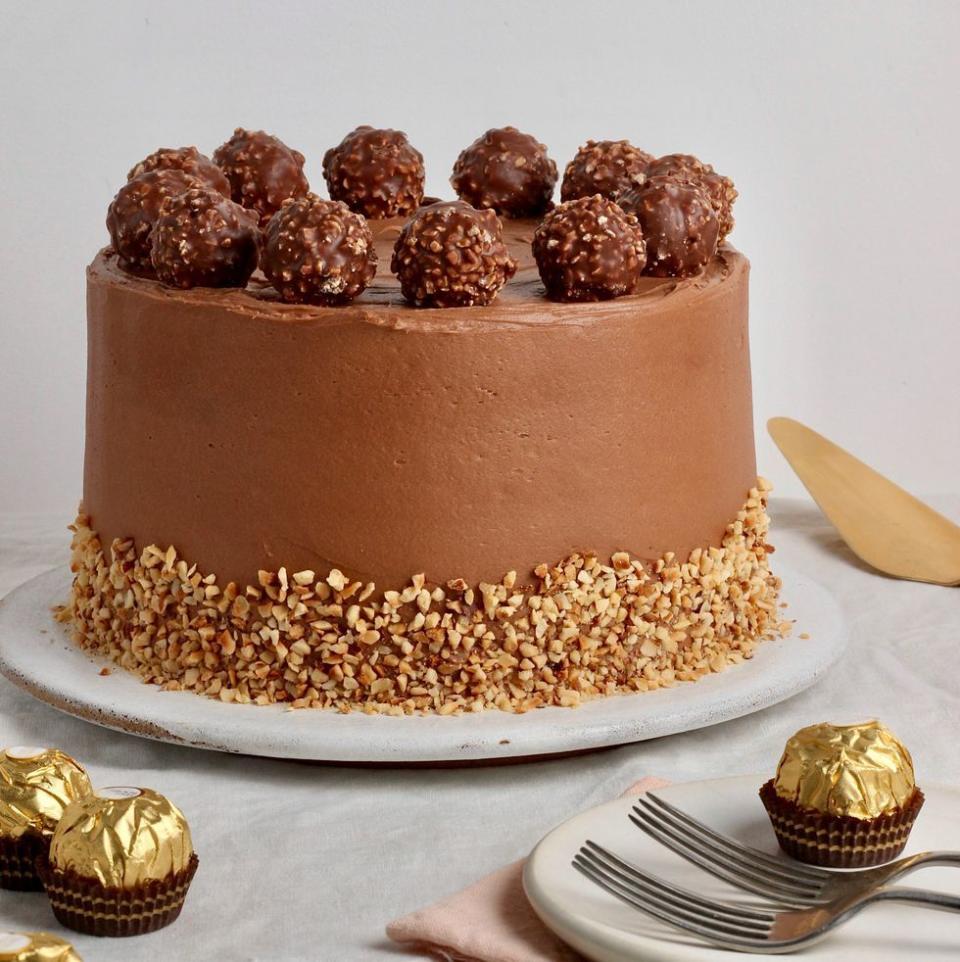 <p>This Ferrero Rocher <a href="https://www.delish.com/uk/cooking/recipes/g31954424/easter-cake-recipes/" rel="nofollow noopener" target="_blank" data-ylk="slk:cake;elm:context_link;itc:0;sec:content-canvas" class="link ">cake</a> is a seriously indulgent bake with a soft, hazelnut spiked sponge coated in a delicious <a href="https://www.delish.com/uk/cooking/recipes/a35582220/nutella-cups-recipe/" rel="nofollow noopener" target="_blank" data-ylk="slk:Nutella;elm:context_link;itc:0;sec:content-canvas" class="link ">Nutella</a> frosting, topped with everyone’s favourite chocolate treats. </p><p>Get the <a href="https://www.delish.com/uk/cooking/recipes/a35901680/fererro-rocher-cake/" rel="nofollow noopener" target="_blank" data-ylk="slk:Fererro Rocher Cake;elm:context_link;itc:0;sec:content-canvas" class="link ">Fererro Rocher Cake</a> recipe.</p>