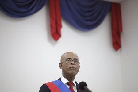 Haiti's outgoing President Michel Martelly speaks at a ceremony marking the end of his presidential term, in the Haitian Parliament in Port-au-Prince, Haiti, February 7, 2016. REUTERS/Andres Martinez Casares