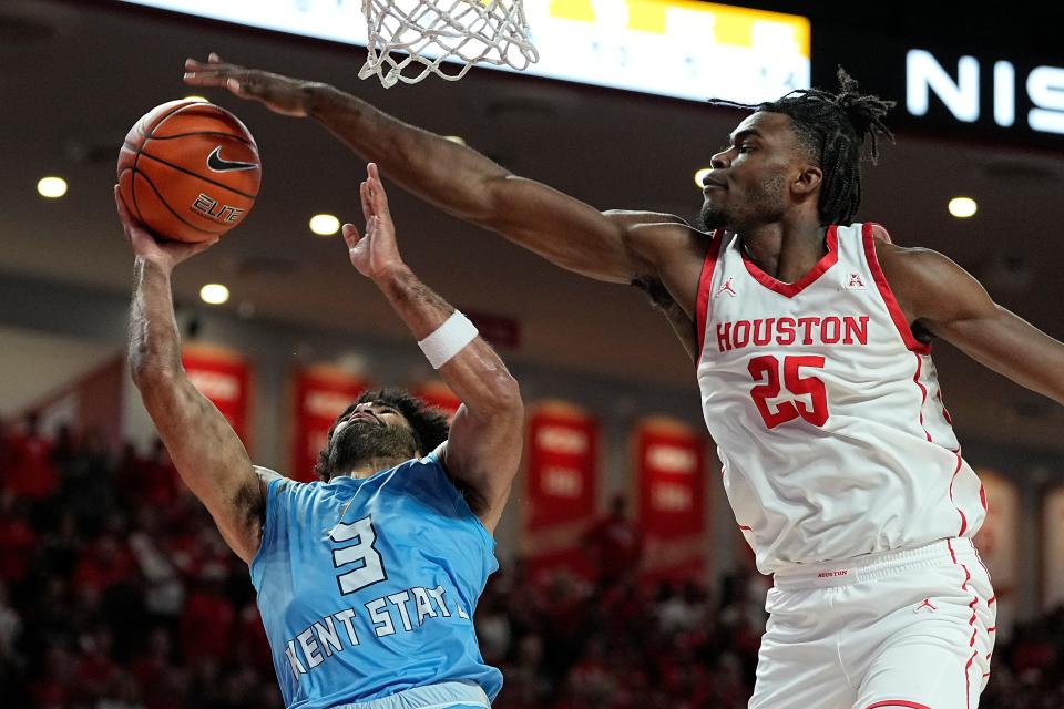 Kent State guard Sincere Carry (3) is blocked by Houston forward Jarace Walker (25) during the second half of an NCAA college basketball game Saturday, Nov. 26, 2022, in Houston. (AP Photo/Kevin M. Cox)