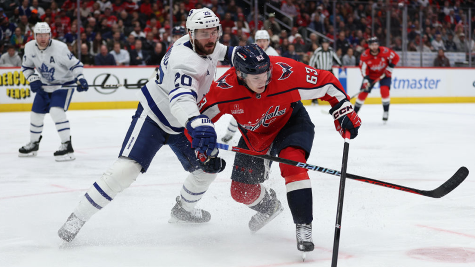 WASHINGTON, DC - MARCH 20: Ivan Miroshnichenko #63 of the Washington Capitals collides with Joel Edmundson #20 of the Toronto Maple Leafs during the second period at Capital One Arena on March 20, 2024 in Washington, DC.