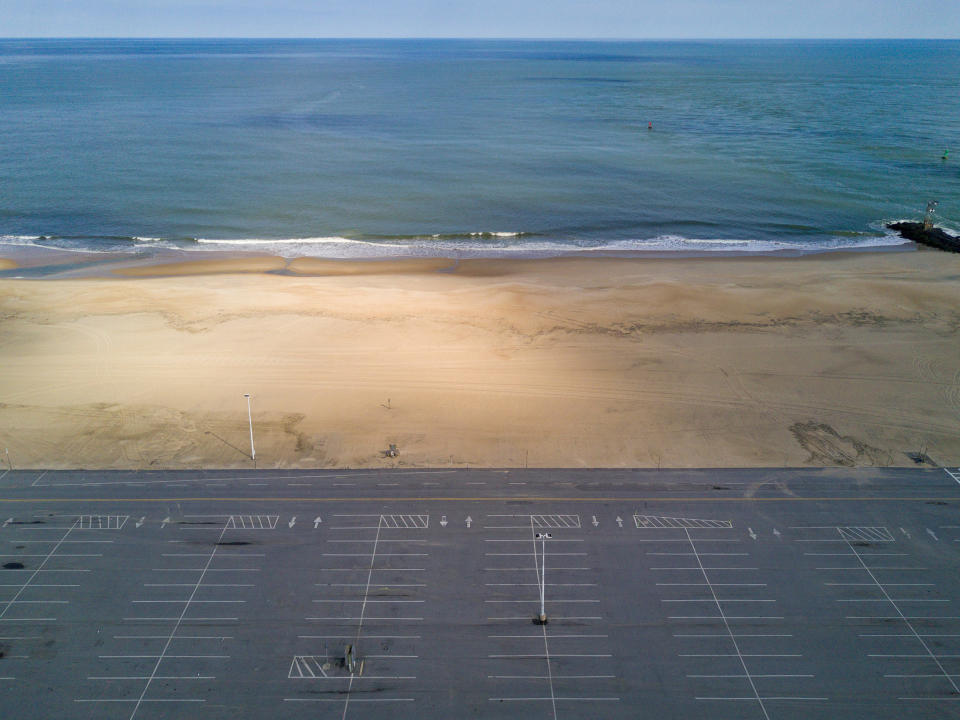 An empty parking lot in the <a href="https://time.com/5829777/governors-reopening-coronavirus/" rel="nofollow noopener" target="_blank" data-ylk="slk:beach town;elm:context_link;itc:0;sec:content-canvas" class="link ">beach town</a> of Ocean City, Md., on April 16.<span class="copyright">Peter van Agtmael—Magnum Photos for TIME</span>