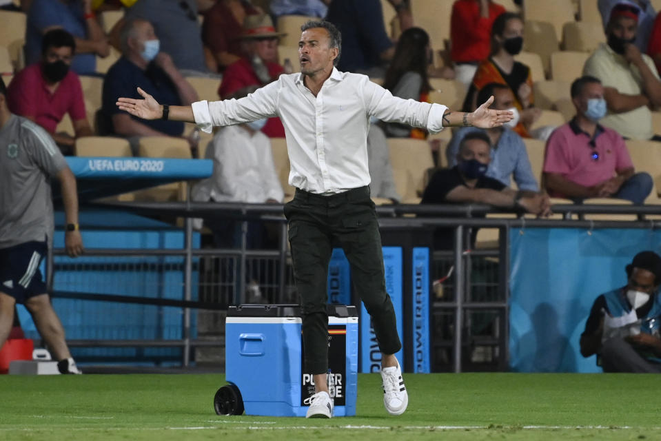 Spain's manager Luis Enrique gestures during the Euro 2020 soccer championship group E match between Spain and Sweden at La Cartuja stadium in Seville, Monday, June 14, 2021. (AP Photo/Pierre Philippe Marcou, Pool)