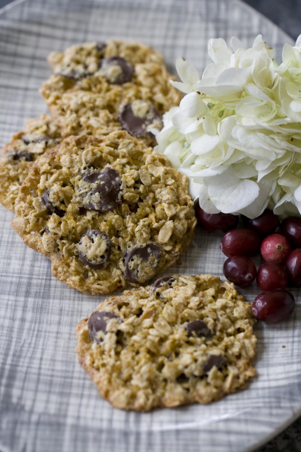 This Oct. 28, 2013 photo shows a plate of healthy lace cookies in Concord, N.H., made with oatmeal, butter, white sugar, a whole egg and vanilla extract. (AP Photo/Matthew Mead)