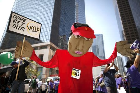 People protest for a $15-an-hour nationwide minimum wage in Los Angeles, California, United States, April 14, 2016. REUTERS/Lucy Nicholson