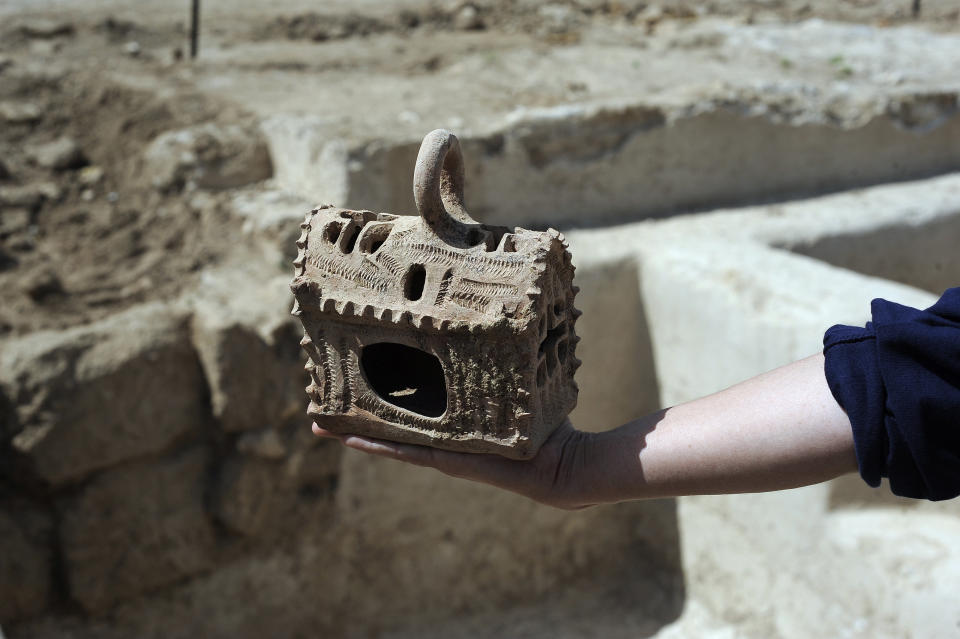 In the ruins of a Byzantine settlement near Ashkelon, Israel, archeologists found a well-preserved 1,500 lantern that projects crosses on the wall when lit. A large wine press was also found. (DAVID BUIMOVITCH/AFP/Getty Images)  <a href="http://www.huffingtonpost.com/2013/04/05/byzantine-artifacts-unear_n_3022162.html" target="_blank">Read more here.</a>