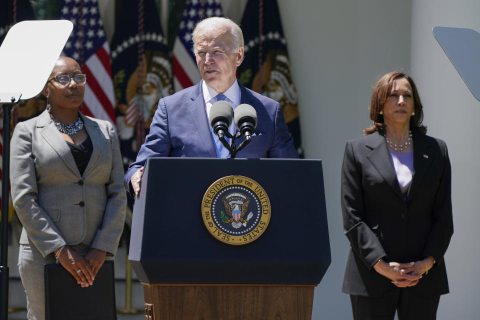 Vice President Kamala Harris, right, listens as President Joe Biden speaks at an event on lowering the cost of high-speed internet in the Rose Garden of the White House, Monday, May 9, 2022, in Washington. (AP Photo/Manuel Balce Ceneta)