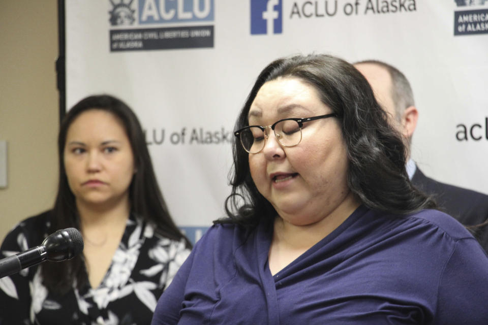 Clarice Hardy speaks at a news conference Thursday, Feb. 20, 2020, in Anchorage, Alaska. The American Civil Liberties Union of Alaska filed a lawsuit Thursday on Hardy's behalf against the City of Nome, Alaska, and two former officers for failing to investigate the sexual assault report filed by Hardy, a former police dispatcher. On the left is Kendri Cesar, an attorney with a Juneau law firm that is assisting with the case. (AP Photo/Mark Thiessen)