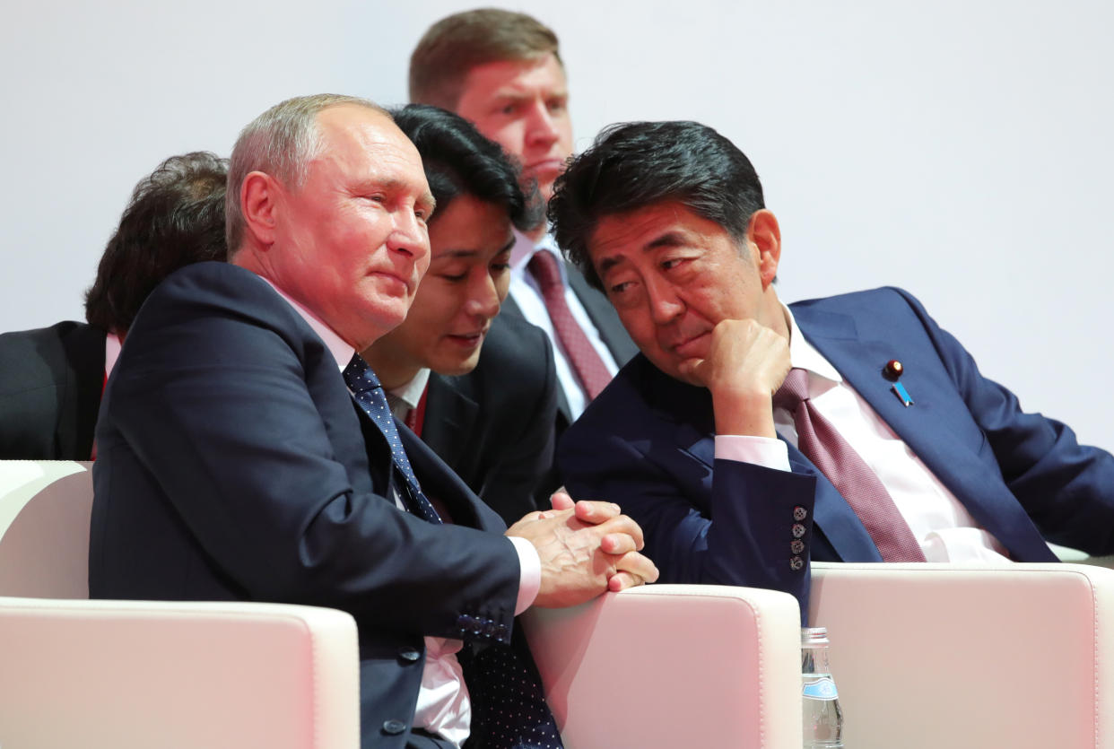 Russian President Vladimir Putin and Japanese Prime Minister Shinzo Abe.