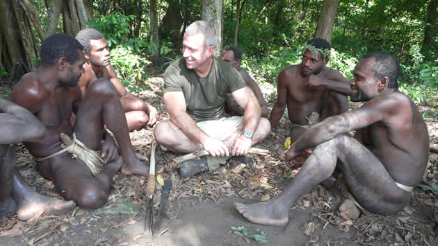 Hayden Turner interacts with members of a hunter-gatherer tribe in his "Man Hunt" series. (Photo courtesy of National Geographic Channel)