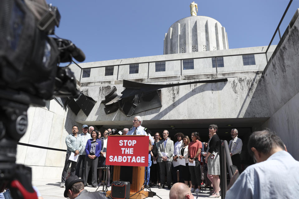 FILE - Democratic Sen. Jeff Golden speaks during a news conference and rally against the Republican Senate walkout at the Oregon State Capitol in Salem, Ore., June 6, 2023. Funding for schools, literacy programs and special education teachers in Oregon — a state where 60% of third graders are not reading at grade level — could be jeopardized by a Republican walkout that has stalled hundreds of bills and ground the Legislature to a partisan halt for over a month. (AP Photo/Amanda Loman, File)